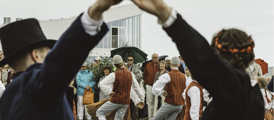 Dancers perform Estonian folk dances in traditional clothes. 