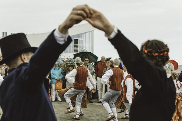 Dancers perform Estonian folk dances in traditional clothes. 