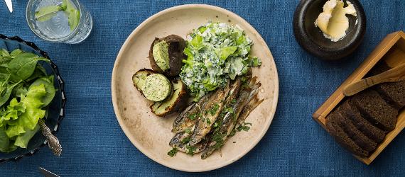 Grilled vendace with fire-roasted potatoes, herb butter and green salad
