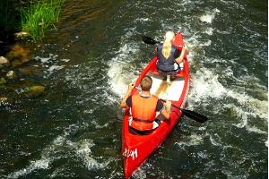 Canoeing over mill dams on Võhandu River