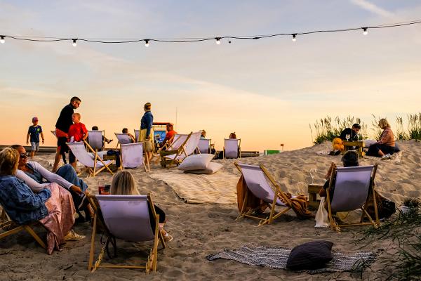 Beach chairs between the dunes overlooking the sea