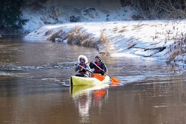 Winter canoe trip and crisp snowy shores