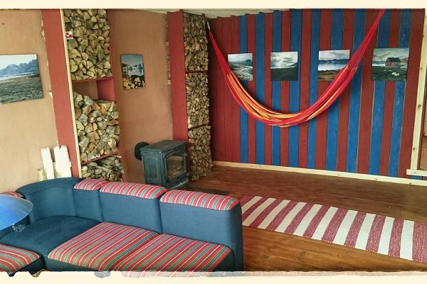 Interior view of the unconventional and cozy straw bale house