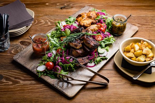 Grilled dish on a wooden tray