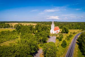 Church from high up, blue sky, forest