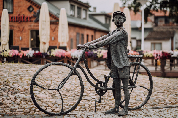Sculpture 'Young man on bicycle listening to music'