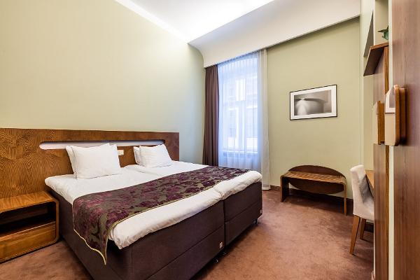 Ett sovrum i sviten på Hotell Soho