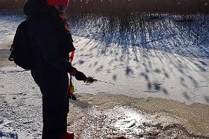 Winter walk in the forest and ice fishing