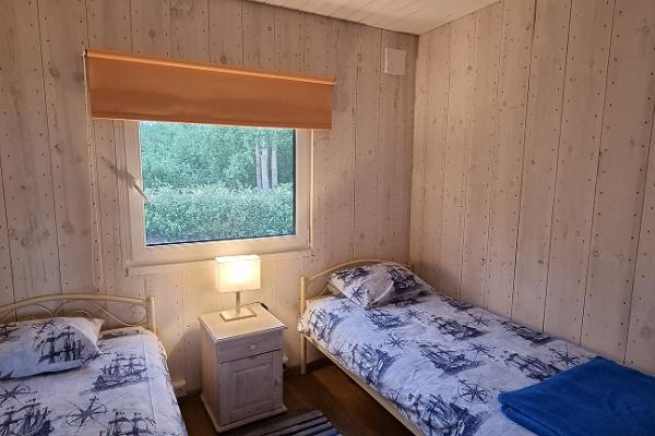 Pildil Jõesuu Turismitalu puhkekeskuse magamistuba
