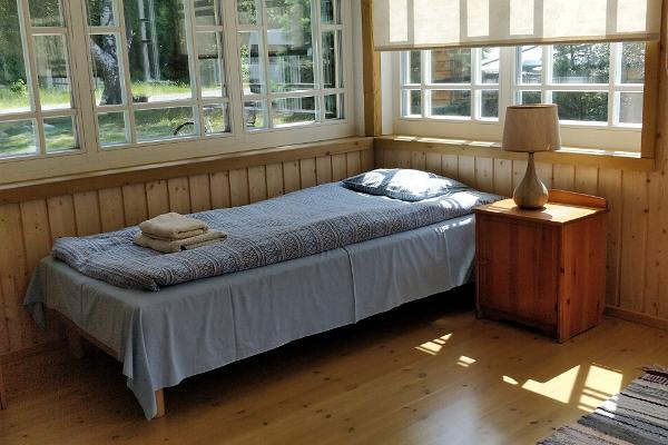 A bed in the Liise Farm porch room