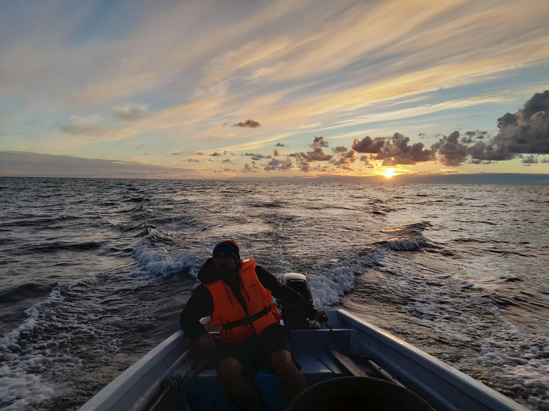 Fishing trip ʹChecking fish trap at sea with a fishermanʹ