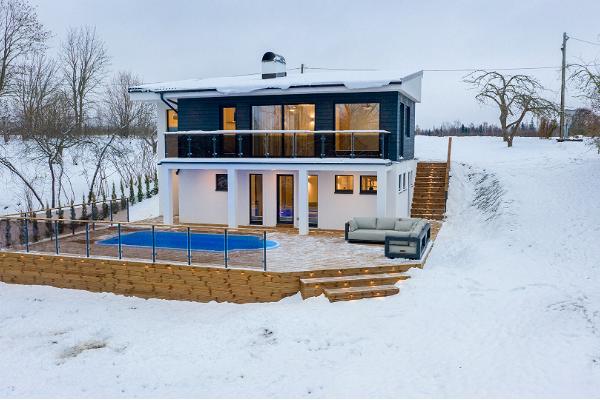 Kalda Villa holiday home with a heated outdoor pool in winter