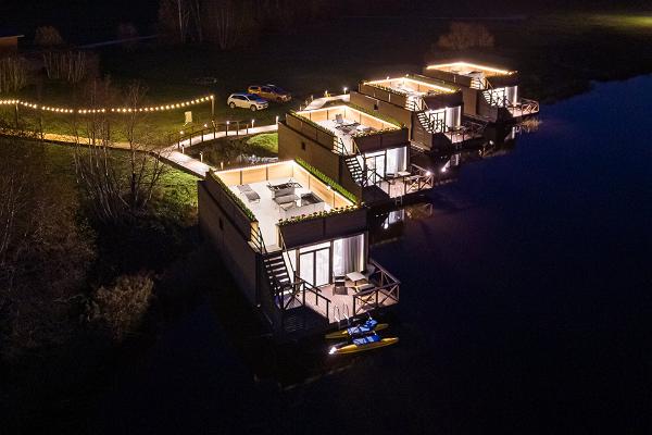 Raft Villas lit at night
