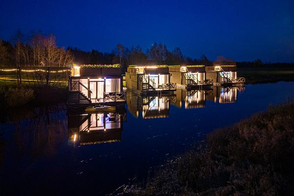 Raft Villas lit at night